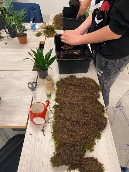 Creating a Kokedama in a floral workshop with expert botanist 3