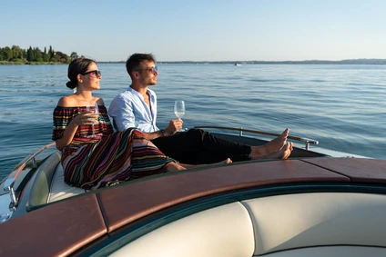 Riva private outing with a skipper from Lazise: the elegance of a classic boat on Lake Garda
