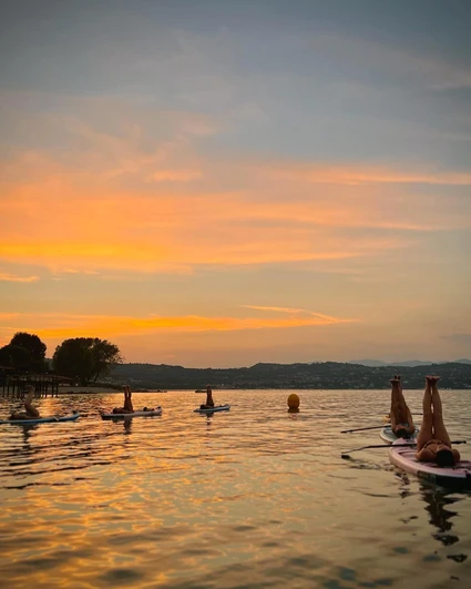 SUP yoga at sunset in the bay of Desenzano del Garda 25