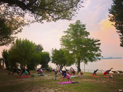 Yoga group lesson outdoors with a view on Lake Garda 6