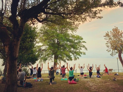 Yoga group lesson outdoors with a view on Lake Garda 8