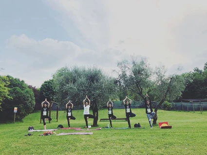 Yoga group lesson outdoors with a view on Lake Garda 12