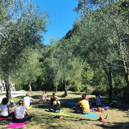 Yoga group lesson outdoors with a view on Lake Garda 17