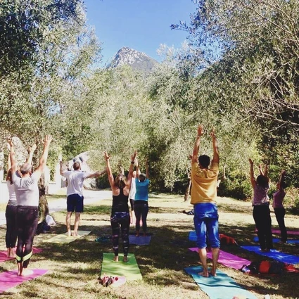 Yoga group lesson outdoors with a view on Lake Garda 26
