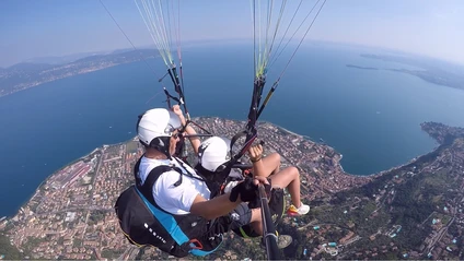 Tandem paragliding flight: from Monte Pizzocolo to Lake Garda
