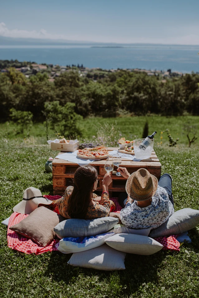 Outdoor picnic in a wine resort at Lake Garda